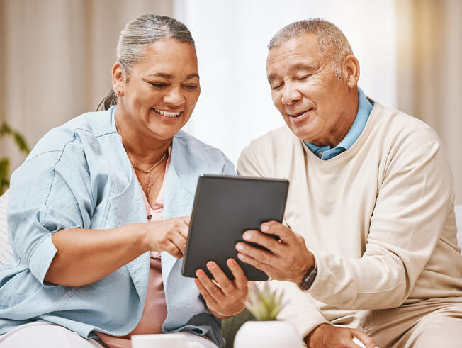 Senior couple using tablet